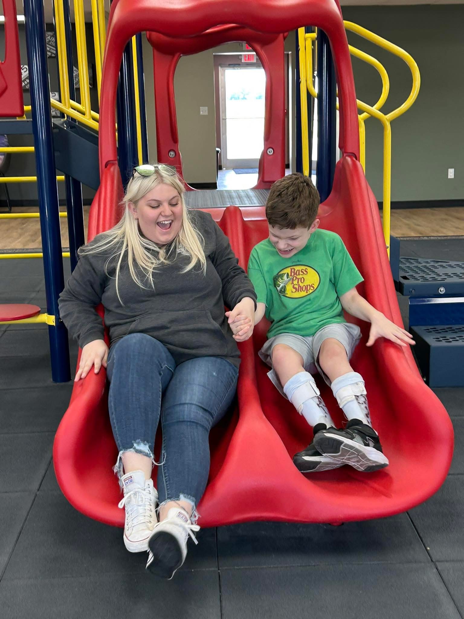 Staff member comforting a participant on a couch, demonstrating the caring supportive environment of the Discovery Program